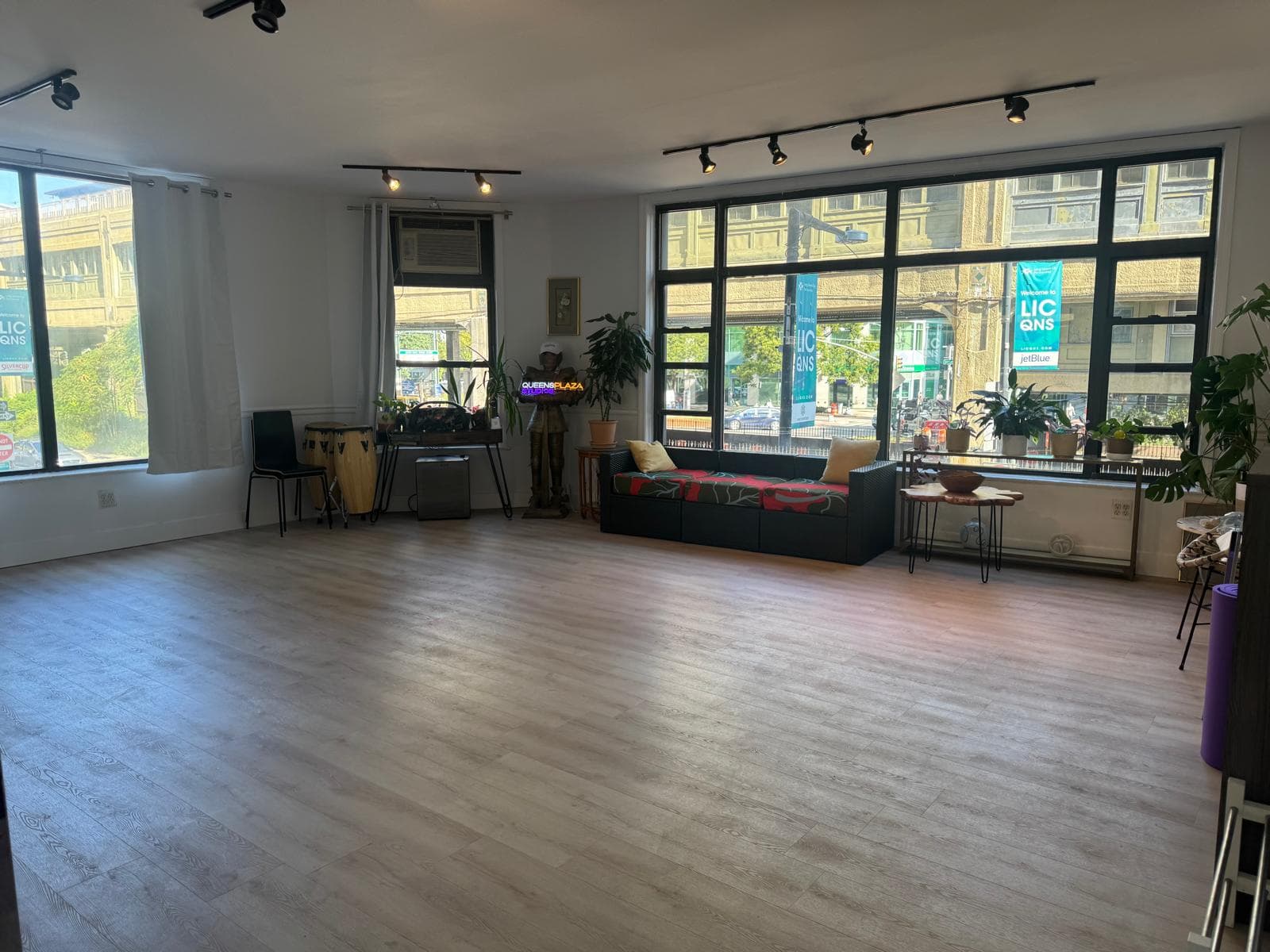 Daylight-filled studio with large windows at Queens Plaza Studios in Long Island City