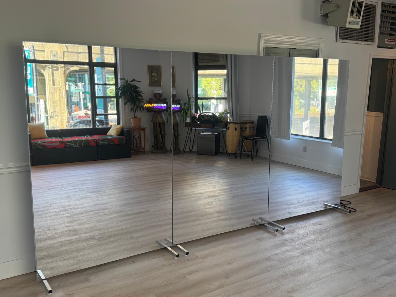 Full-length rolling mirrors set up in the studio